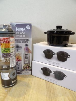 a blender and a blender sitting on a table next to a box
