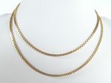 a close up of a gold chain necklace on a mannequin mannequin