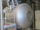 a large metal tank sitting inside of a building