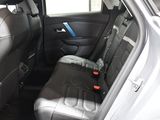 the back seats of a car are black and grey in color