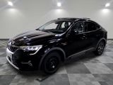 the black suv is parked on a checkered floor in the garage