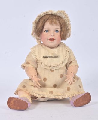 a doll that is sitting on the ground wearing a dress and hat