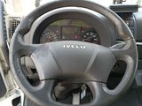 dashboard of a vehicle with a steering wheel and dashboard controls