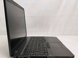 an open laptop computer sitting on top of a white surface