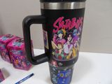 a mug that has a picture of a group of cartoon characters on it