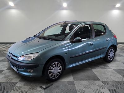 a picture of a blue car parked in a garage