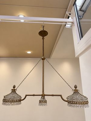 a chandelier hanging from the ceiling in a room