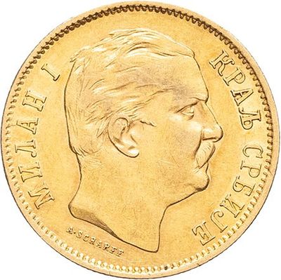 a close up of a gold coin with a man ' s face on it