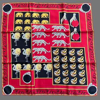 an image of a red and black scarf with elephants and leopards on it