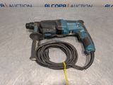 a close up of a cord connected to a drill on a table