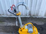 a yellow machine that is sitting on the ground