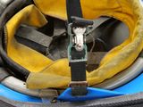 a helmet with a hose attached to it on a boat