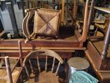 a pile of chairs and a table in a room