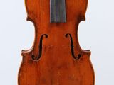 an old violin with a black bow on a white background