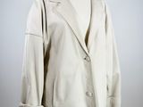 jacket on a mannequin stand on a white background