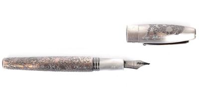 two pens sitting next to each other on a white surface