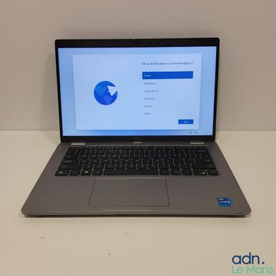 an open laptop computer sitting on top of a white table
