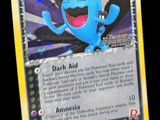 une carte Pokémon sur laquelle figure un visage bleu