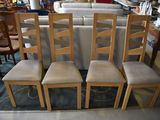 six chairs in the middle of a room with a rug on the floor