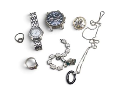 many different types of jewelry on a white surface