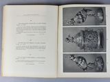 an open book with a picture of a cat and a bird