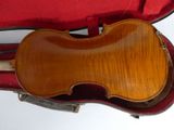 a violin in a case with a bow in it