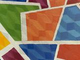 a painting of a multicolored geometric design on the wall