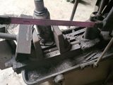 a machine that is working on a piece of metal