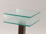 a glass table with a wooden base on a white background