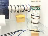 a glass table with a display of jewelry on it