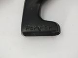 a close up of a black plastic object on a white surface