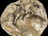 an image of a bronze coin with a man riding a horse