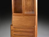 an old wooden cabinet with a glass door and drawers