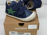 baby boy ' s shoes in a box with a star on the side