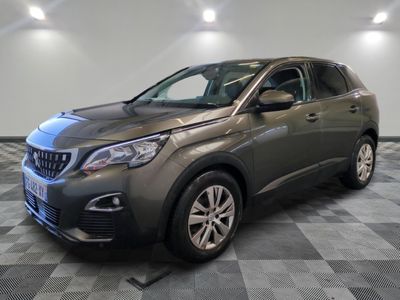 the grey suv is parked on a checkered floor in a garage