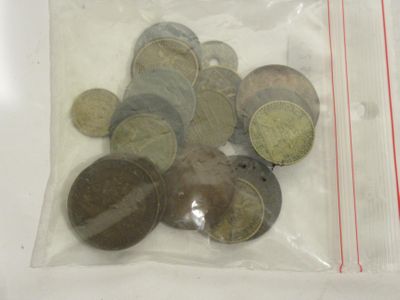 a lot of coins in a bag on the table
