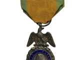 une image représentant une médaille surmontée d'un aigle