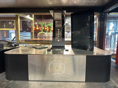 an image of a counter in a restaurant with a sign on it