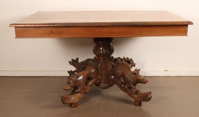 an image of a wooden table with carvings on top of it