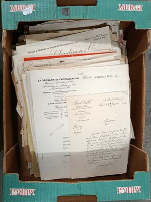 a box with a lot of papers in it