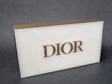 a close up of a sign with the word dior on it