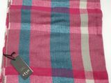 a pink and blue plaid scarf with a tag on it