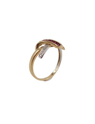 a close up of a gold ring with a red and white diamond