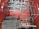 a red container with a bunch of cages inside of it