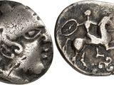 a close up of a coin with a horse on it
