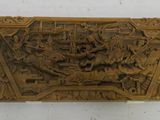 an old carved wooden plaque with a picture of a man on a horse