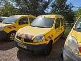 three yellow vans parked in a parking lot next to each other
