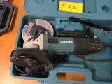 a blue tool box with tools in it on a table