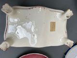 three plates and a bowl sitting on a table
