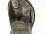 statue of a bird on a pedestal with a white background